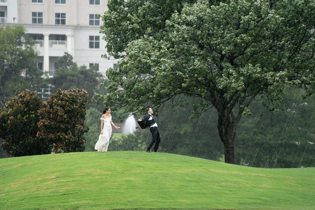 Hurricane Florence 2018 wedding couple in Rain shoot Ballantyne Hotel
