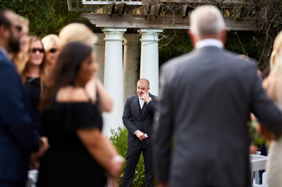 groom with tears down aisle